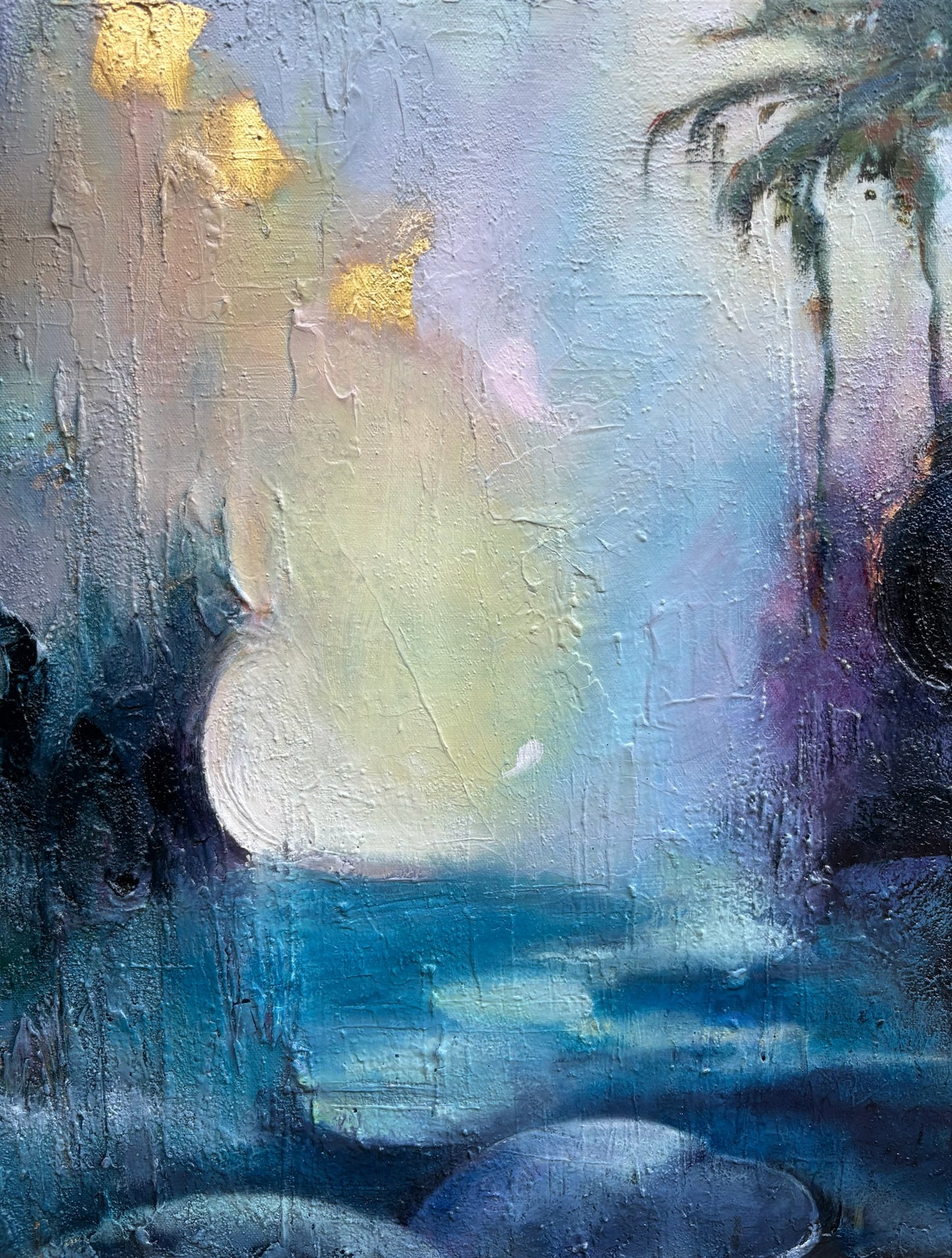 Abstract mixed-media painting with soft layers of blues, violets, and gold. A luminous moon appears above a calm landscape, created with oils, interference pigments, and genuine 24-karat gold leaf. The work conveys balance between light and shadow, strength and softness, evoking feelings of tranquility, memory, and quiet refuge.